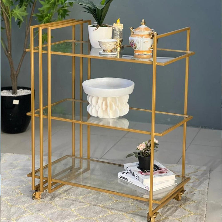 Golden tea trolley on wheels